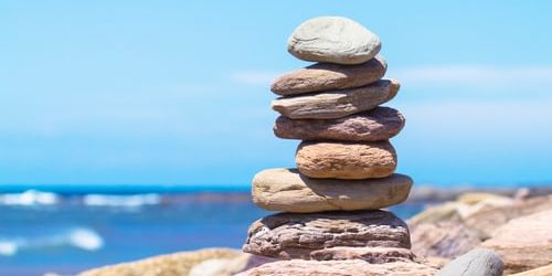 Cairn Rocks A photo of stacked rocks next to the ocean
